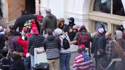 The moment Officer Brian Sicknick is dragged into a mob and beaten