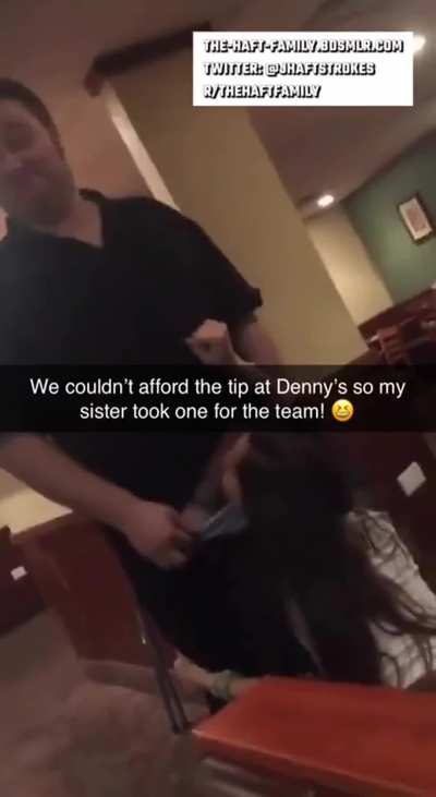 Sister tipping waiter at diner