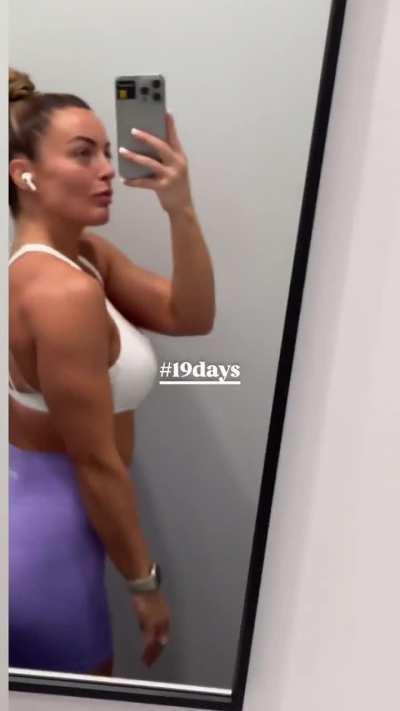 Mandy Rose posing in front of the mirror