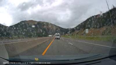 Camper overturns behind vehicle