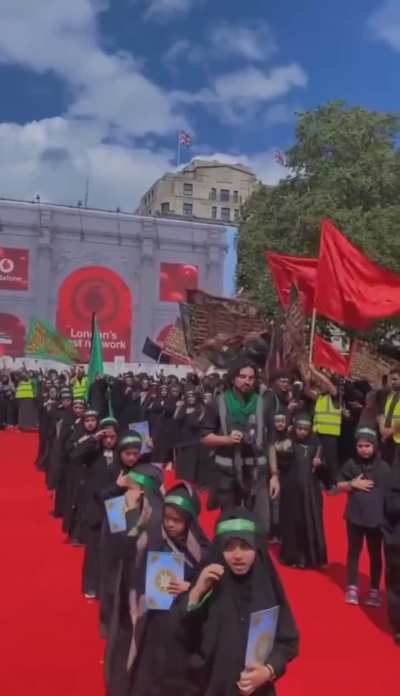 an ashura procession, featuring children that seem to be wearing shia headbands that resemble hamas. 🤑🤑