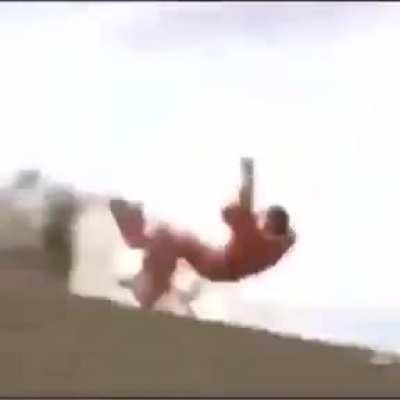 Falling off of a motorcycle going down a hill