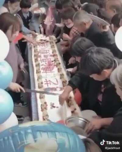 Cutting the cake at a Chinese wedding