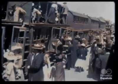 A colorized video of a two-stage train arriving at a station in France, circa 1897.