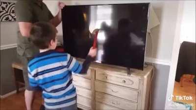 Kid smashes new TV within seconds of getting it