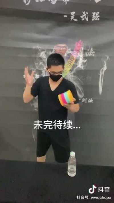 Picking up plastic cups with the slinky