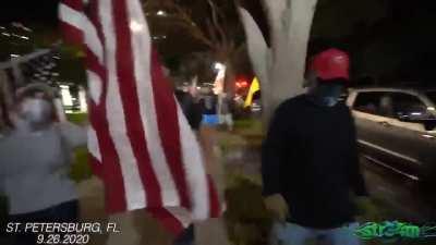 Trump supporters throw peaceful woman protestor headfirst into car then aim loaded gun at de-escalators