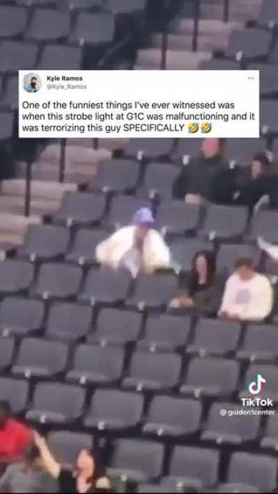 Old man harassed by strobe light