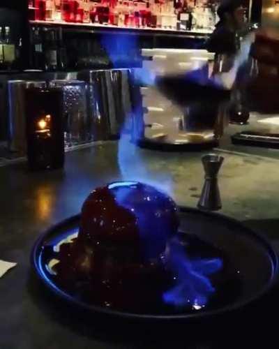 Pouring fire over a burger