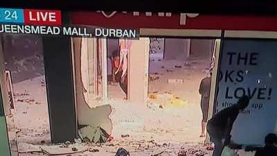 Lady slips during the looting in KZN
