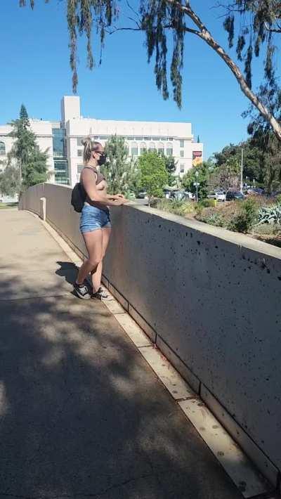 Flashing the cars from on top of a bridge