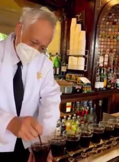 Irish barman making Irish Coffees