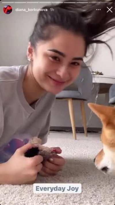 Playing with her dog