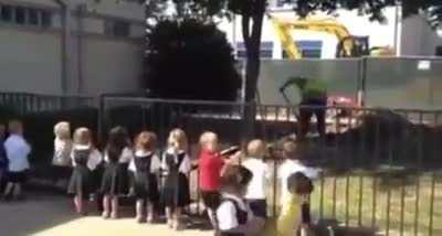 Kids cheer on a worker for his shovelling