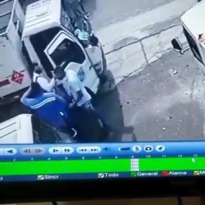 A cylindrical container fell on the bandit's head just in time he was robbing...