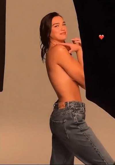 Smiley Dua Lipa topless in jeans