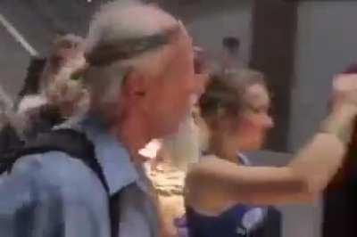 ua pov: Ukrainians crowding the military officials and cursing them.