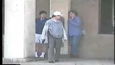 After chasing away looters by shooting at them during the 1992 LA riots, Korean business owners stand guard then a drive-by happens