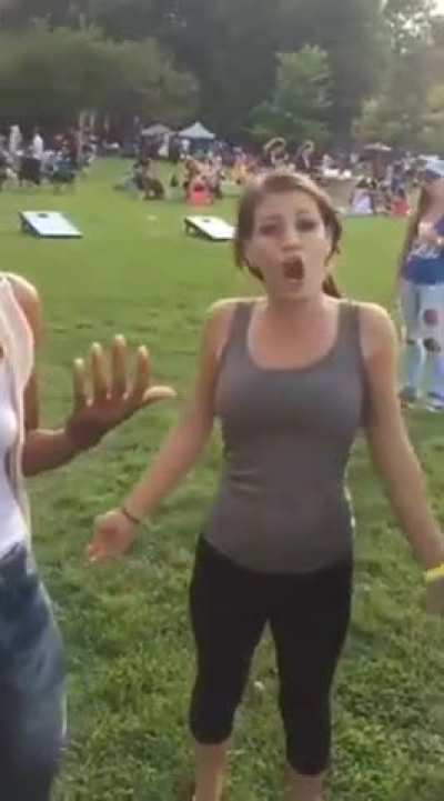 Racist woman says the n-word and spits at someone