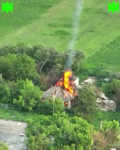 Footage shows a Ukrainian UAV dropping a homemade incendiary bomb into a civilian house that is occupied by Russian soldiers.