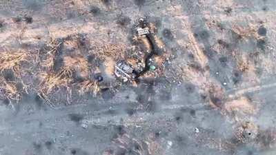 A Ukrainian drone-dropped grenade lands on a Russians shoulder and detonates in his face.