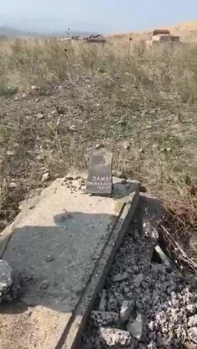 An Azerbaijani soldier visits the destroyed grave of his father in Zengilan / Karabakh, which was liberated by the Azerbaijani army. The Armenians destroyed everything non Armenian in region. Even the graves.