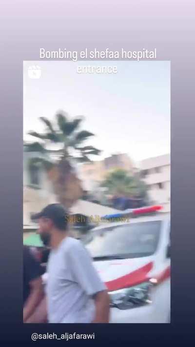 Israrli occupation is bombing Al- Shefaa hospital entrance killing and injuring alot of people 