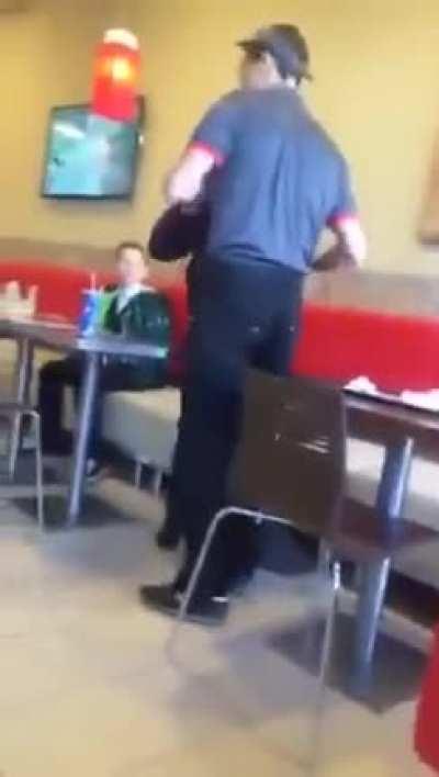 Burger King employee slaps kid who was making a mess and makes him mop up.