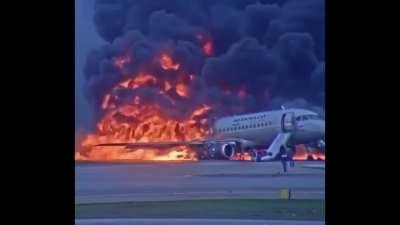 Terrifying footage filmed by a passenger as their plane crash lands on the runway in flames.
