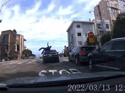[USA] [San Francisco] Car in traffic stops to steal from a parked car. Good Samaritan attempting to intervene is injured. Cop car conveniently gives chase.