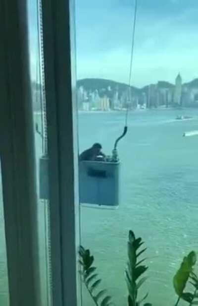 Wcgw cleaning the window on a windy day