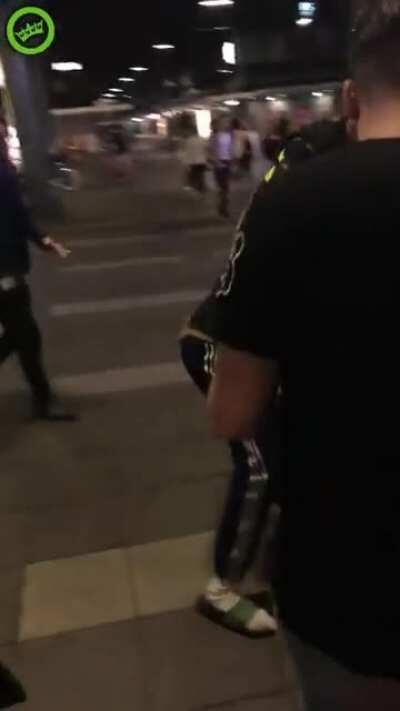 Drunk girl throws a punch at a cop, he punches back