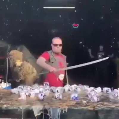 Cutting the beer cans with a stroke of katana
