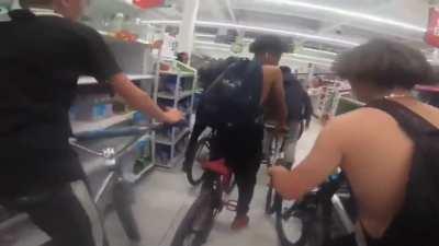 Disrespectful Teens on Bikes Cause Havoc riding through an ASDA Supermarket.