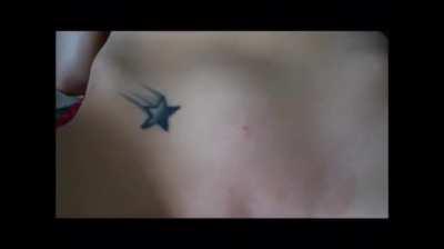 He's trying to poke her belly button