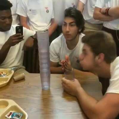 Blowing a cup onto the stack