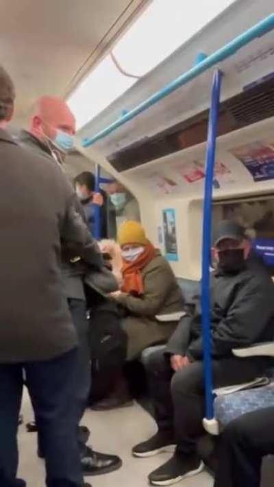 Guy makes everyone on the train think he has to hurl just to steal someone's seat.