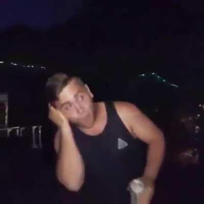 Breaking a glass bottle on your own head