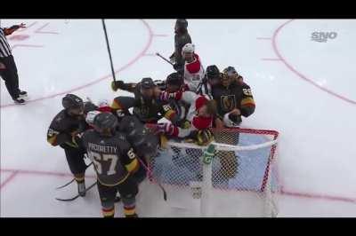 Fleury skates away from scrum and takes Gallagher's helmet with him