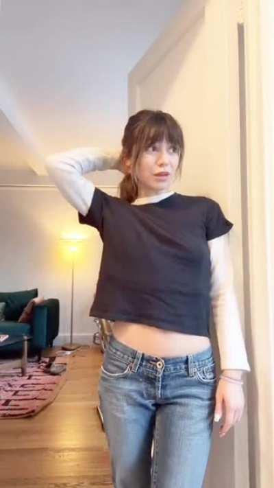 Love the peak of her sexy midriff..