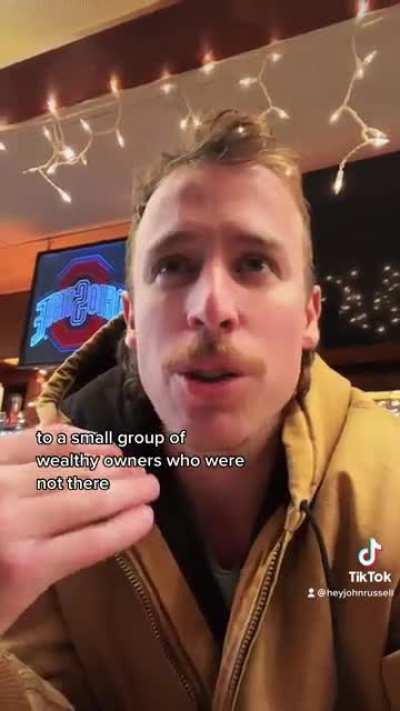 Talking about workers owning the means of production in a small-town dive bar.