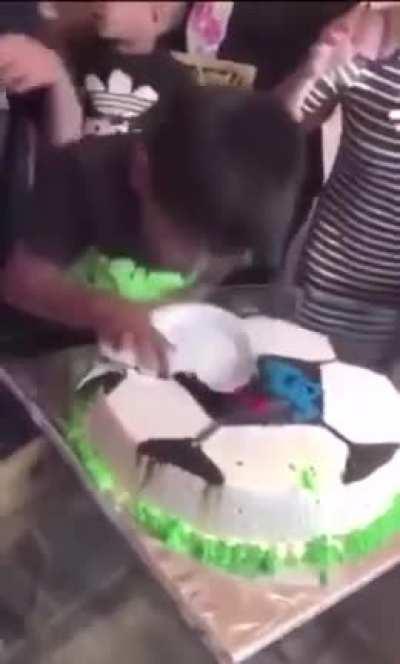 Kid Gets His Face Dunked Into Birthday Cake.