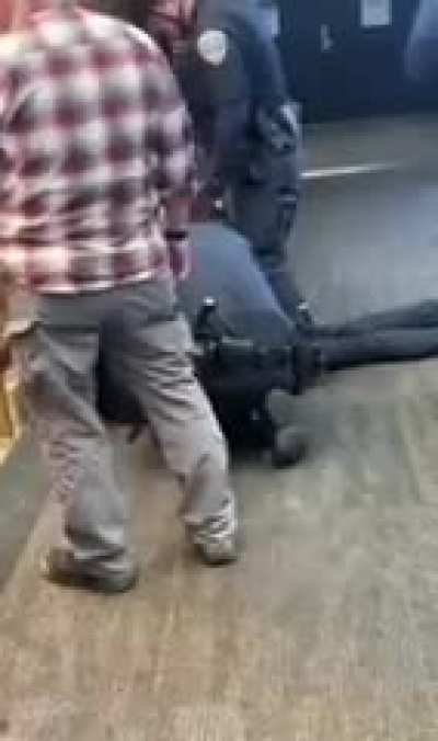 Man loses his shit in the airport, hits a cop and gets taken down