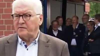 German chancellor hopeful laughs in the background as president holds speech to victims of the floodings