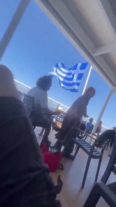 Woman throws speaker off a ship in Greece