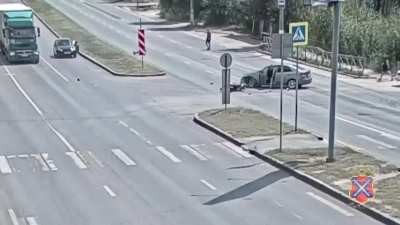 The motorcycle ran through a red traffic light.