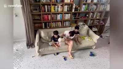 Black magic mum protects kid's head from falling book
