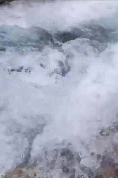 Guy falls from waterfall.