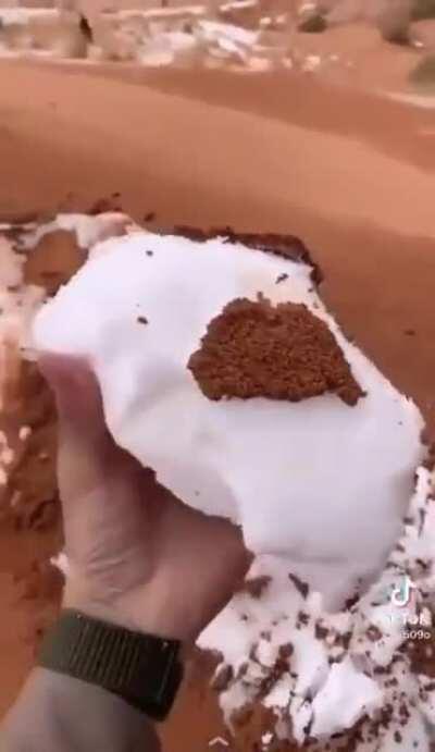 A recent video showing a deposition of snow over sand (dune), then covered by a layer of sand. Tabuk, Saudi Arabia.