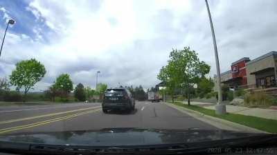 CO cop turning right from the left lane